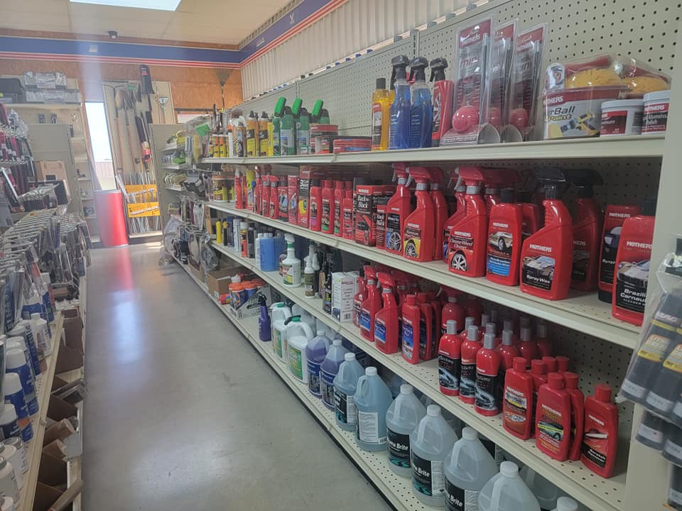 Auto body and paint supply aisle at Holmes Auto Supply in Decatur, TX — Mothers brand detailing products and paint supplies